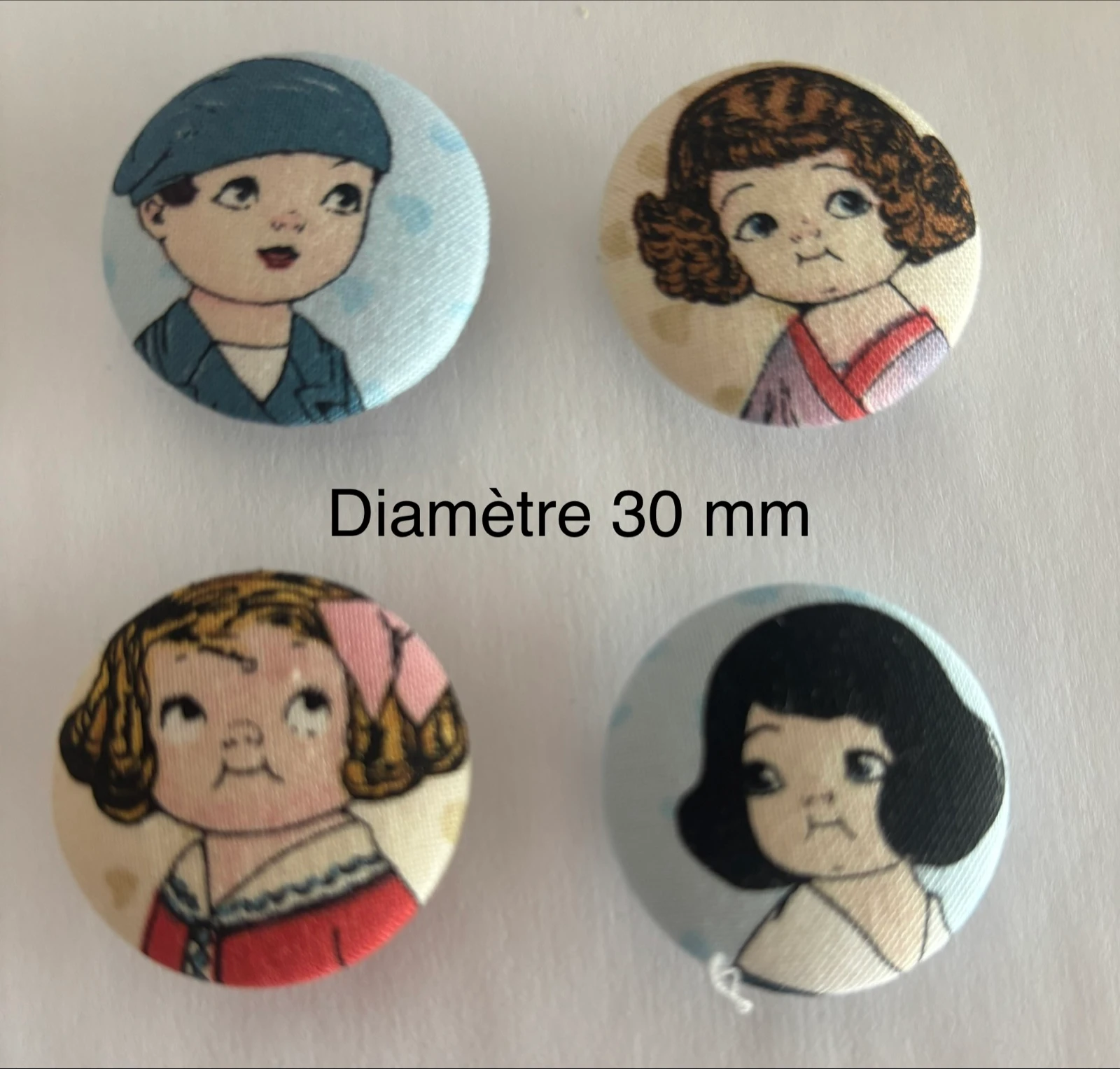 4 boutons recouverts de tissu 
